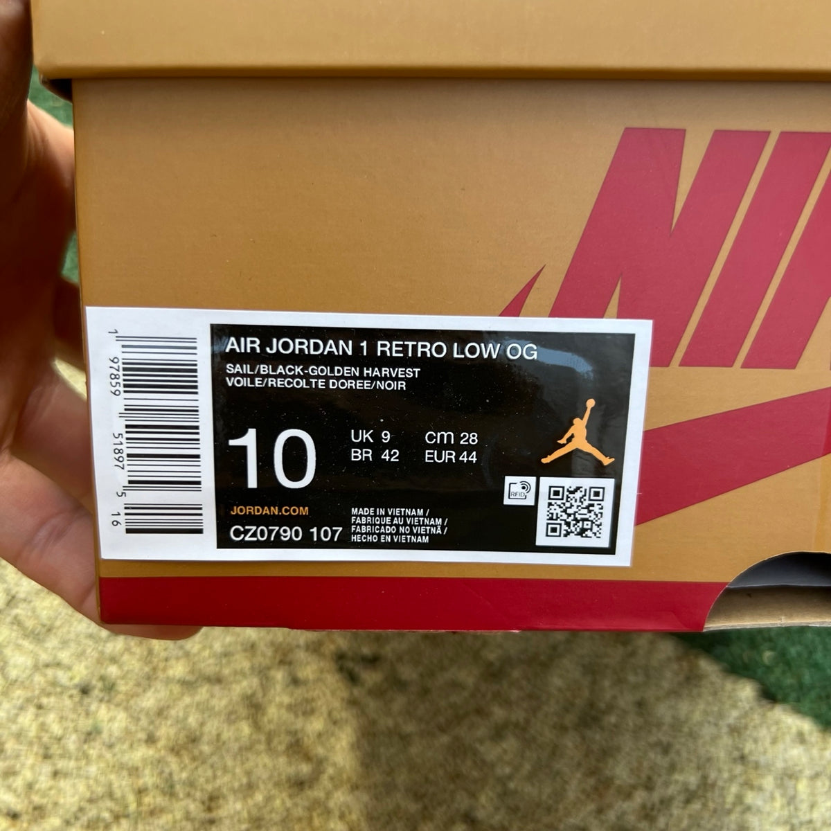 Nike Air Jordan 1 Low OG Rookie of the Year sneakers in black and white with Nike and Jordan branding.