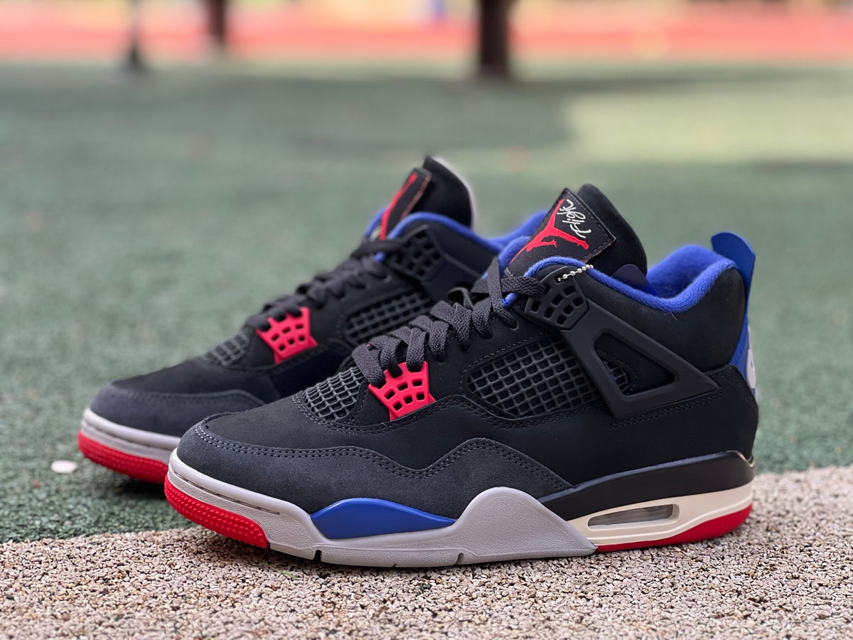 Nike Air Jordan 4 Retro Rare Air sneakers with white lettering, featuring classic design and Nike x Jordan branding