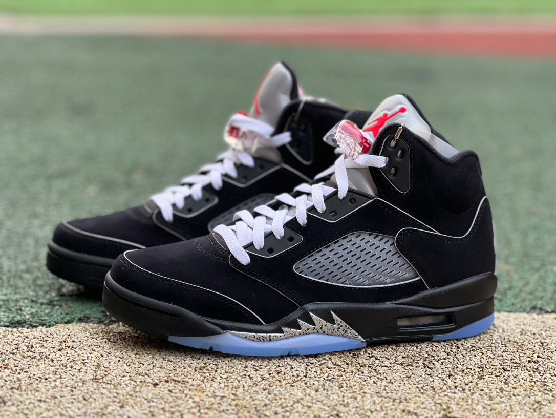 Nike Air Jordan 5 Retro OG sneakers in black metallic with reimagined design, showcasing the iconic Jordan brand style.