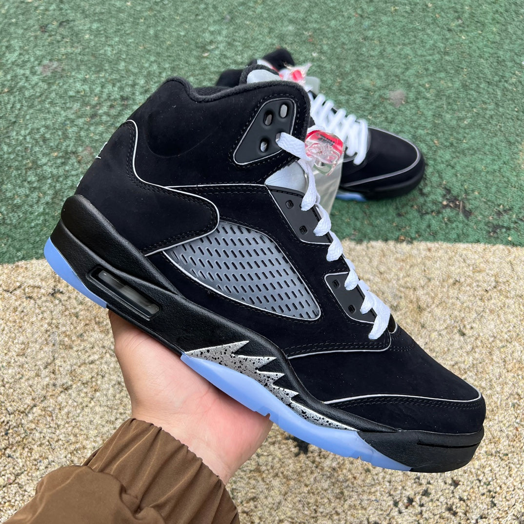 Nike Air Jordan 5 Retro OG sneakers in black with metallic accents, showcasing the iconic design and reimagined details.