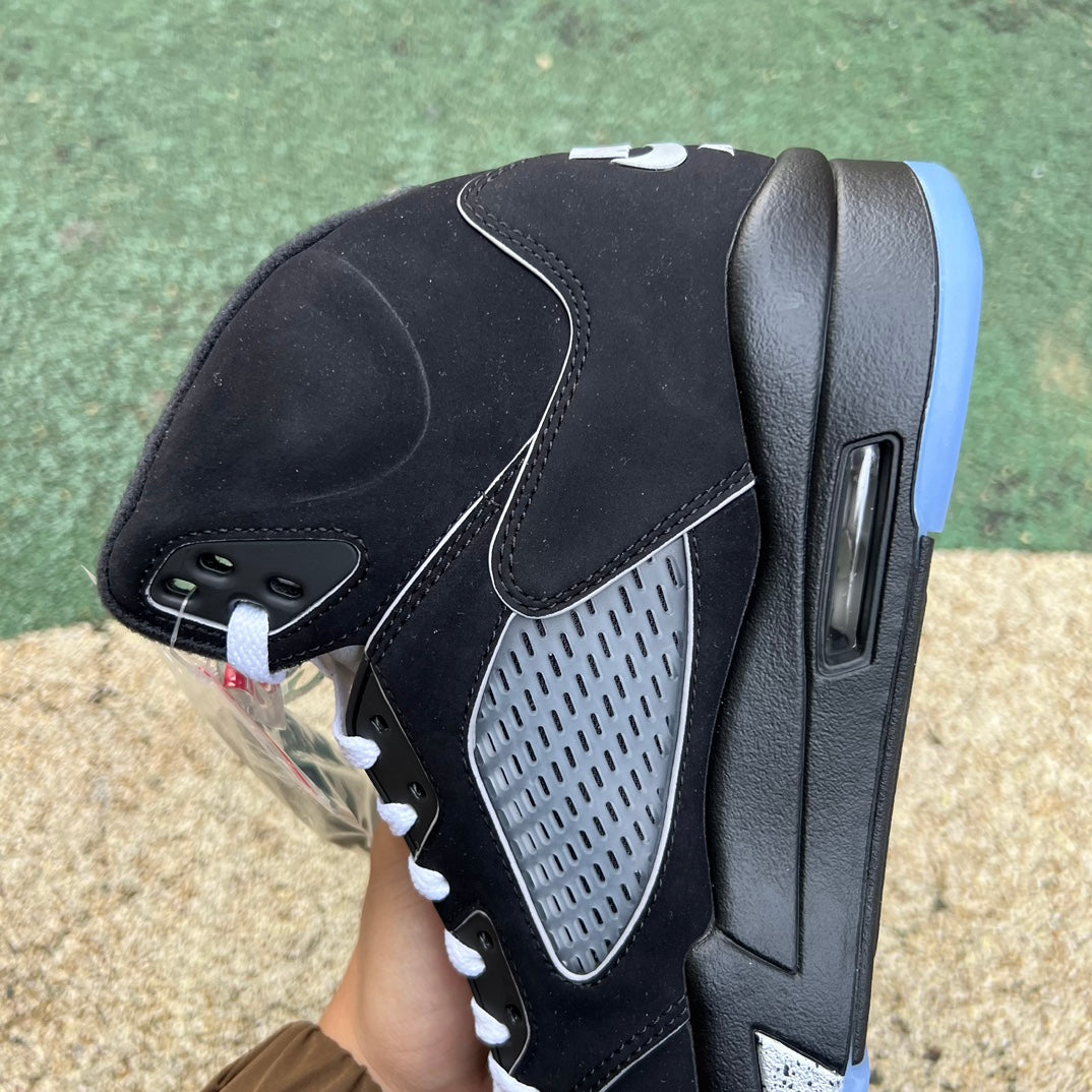 Nike Air Jordan 5 Retro OG black metallic sneakers, reimagined design, featuring sleek black and metallic accents.