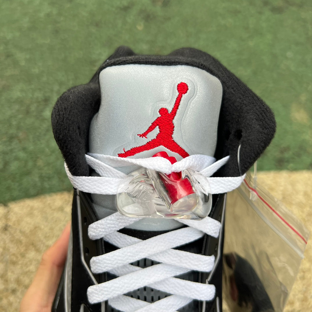 Nike Air Jordan 5 Retro OG sneakers in black metallic with reimagined design, showcasing the classic basketball shoe style.