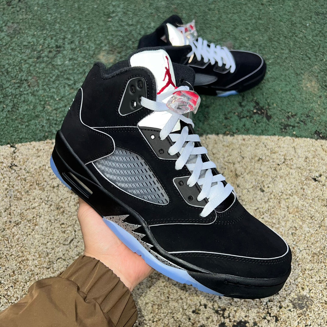 Nike Air Jordan 5 Retro OG sneakers in black with metallic accents, showcasing the classic design and reimagined details.