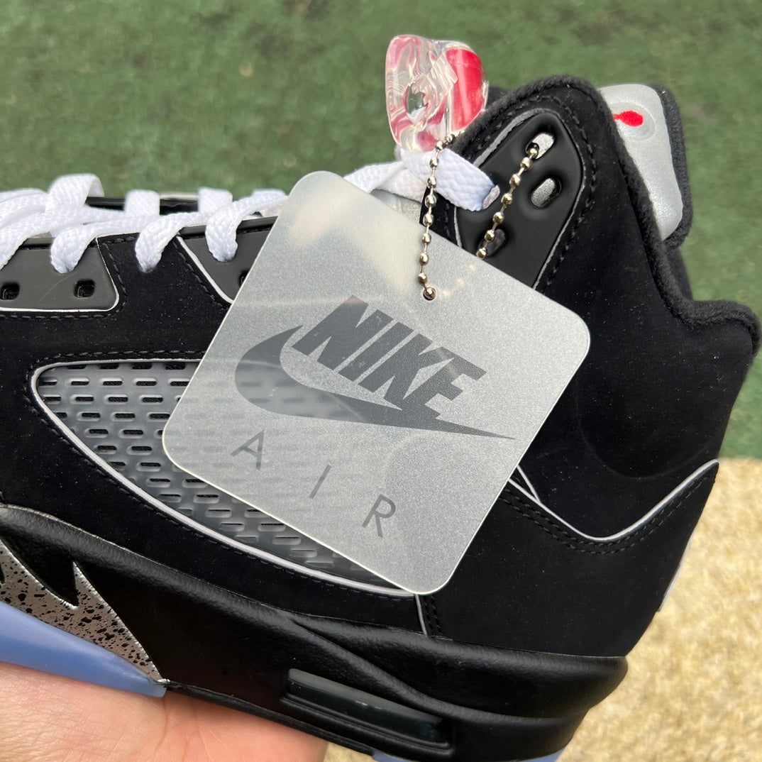 Nike Air Jordan 5 Retro OG sneakers in black metallic colorway with reimagined design, showcasing the iconic basketball shoe style.