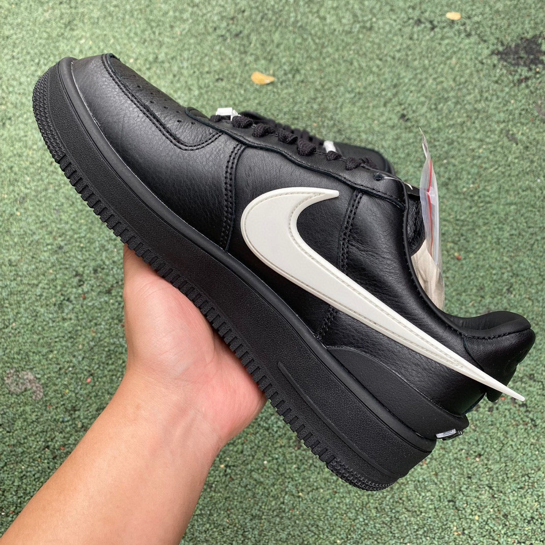 Nike Air Force 1 Low SP AMBUSH black sneakers with signature design details, featuring Nike x Jordan branding and a sleek low-top silhouette.
