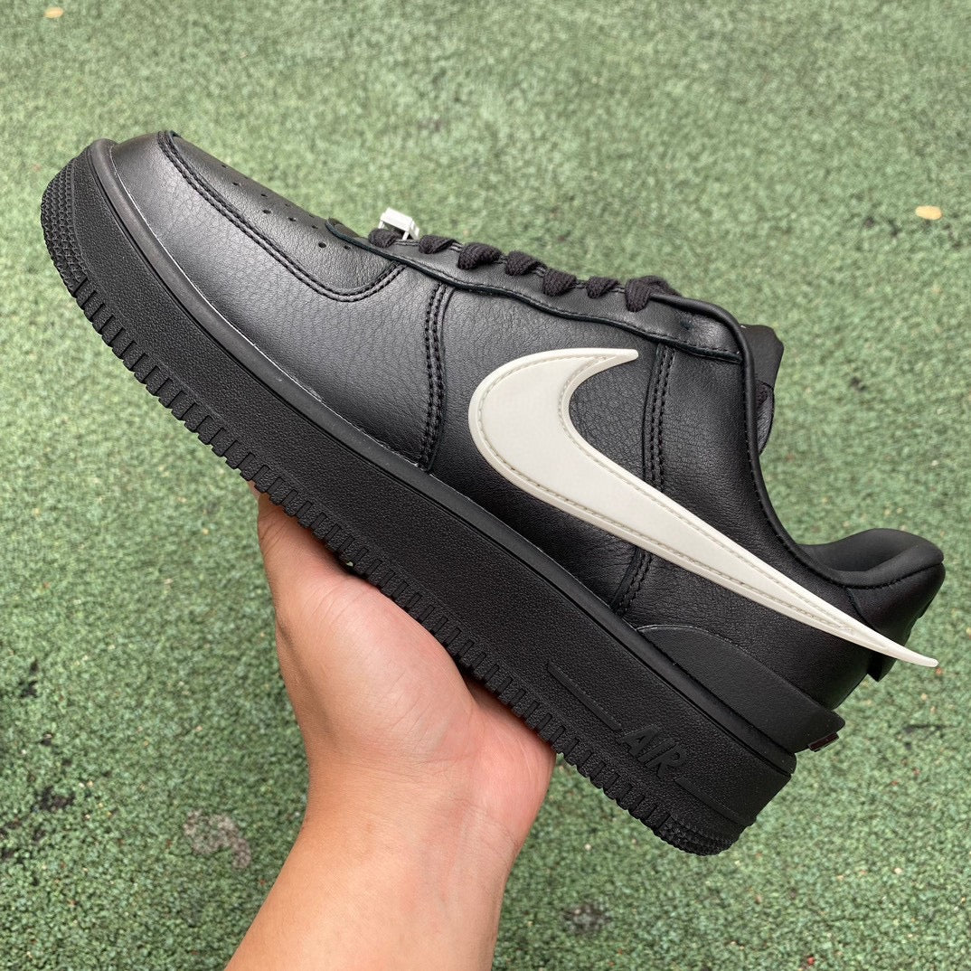 Nike Air Force 1 Low SP AMBUSH black sneakers with white accents, showcasing the collaboration design and classic low-top style.