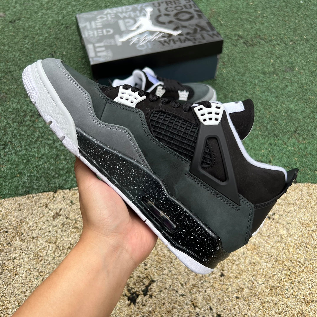 Nike Air Jordan 4 Retro Fear colorway sneaker, featuring black and vibrant accents, from the Nike x Jordan collection.
