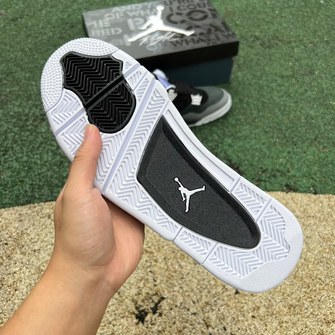Nike Air Jordan 4 Retro Fear 2024 sneakers in black and purple with signature design details and Nike Jordan branding.