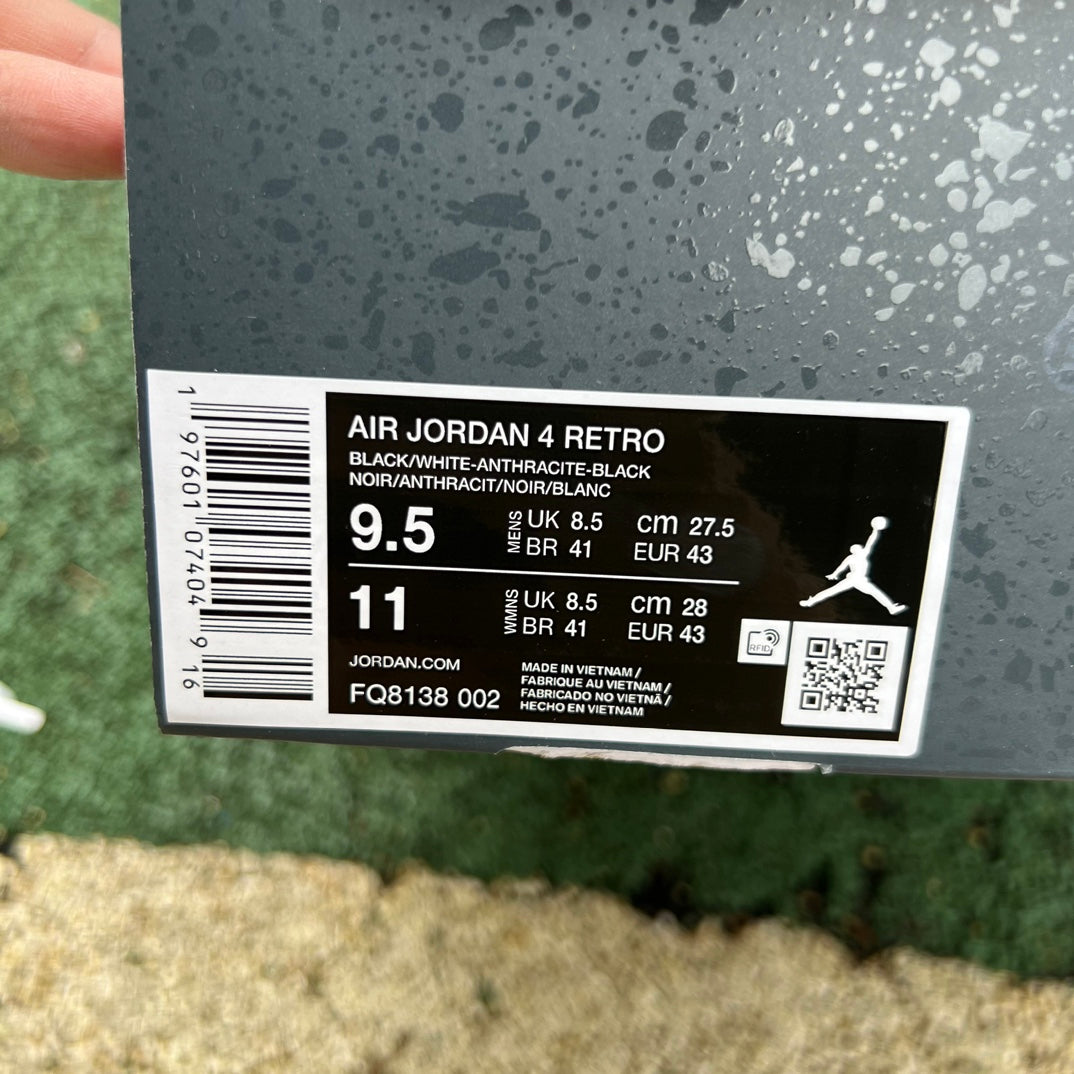 Nike Air Jordan 4 Retro Fear colorway sneaker in black and red with detailed design and branding, shown from a side angle.