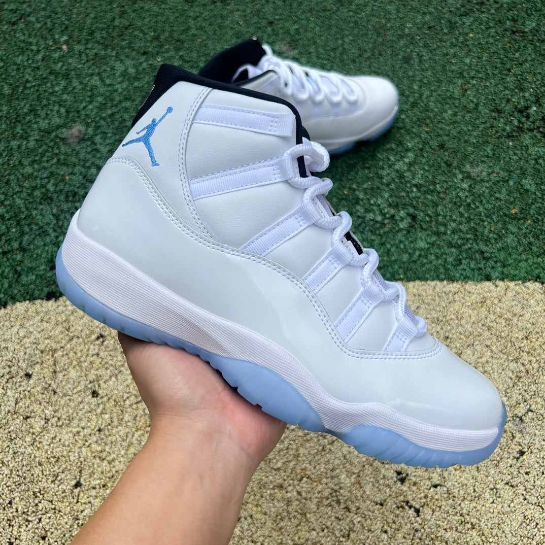 Nike Air Jordan 11 Retro Legend Blue sneakers in white and blue with patent leather accents, designed for sports and casual wear.