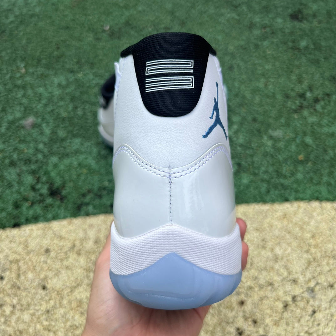 Nike Air Jordan 11 Retro Legend Blue sneakers in white and blue with patent leather and Jumpman logo details.