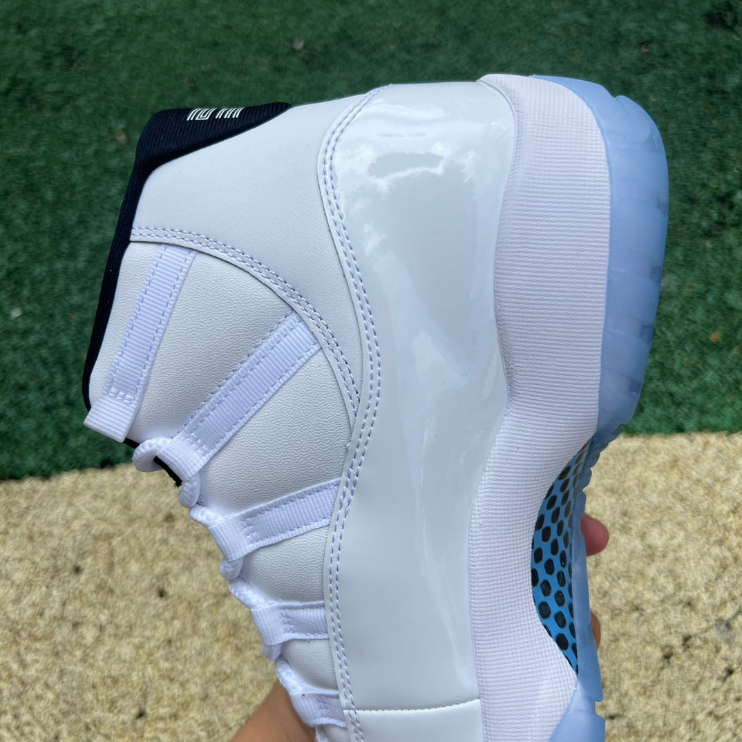 Nike Air Jordan 11 Retro Legend Blue basketball shoes in white and blue with patent leather accents, front view.