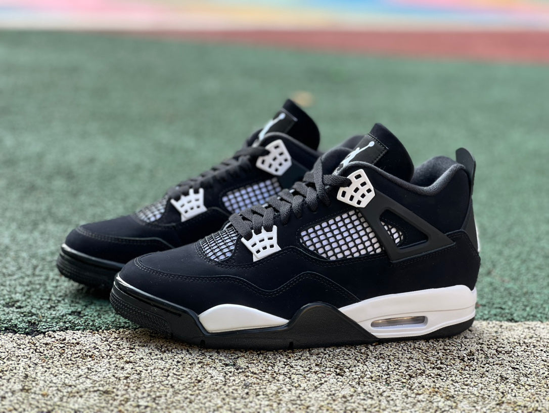 Nike Air Jordan 4 Retro White Thunder sneakers in white and yellow, showcasing the classic design and signature details.