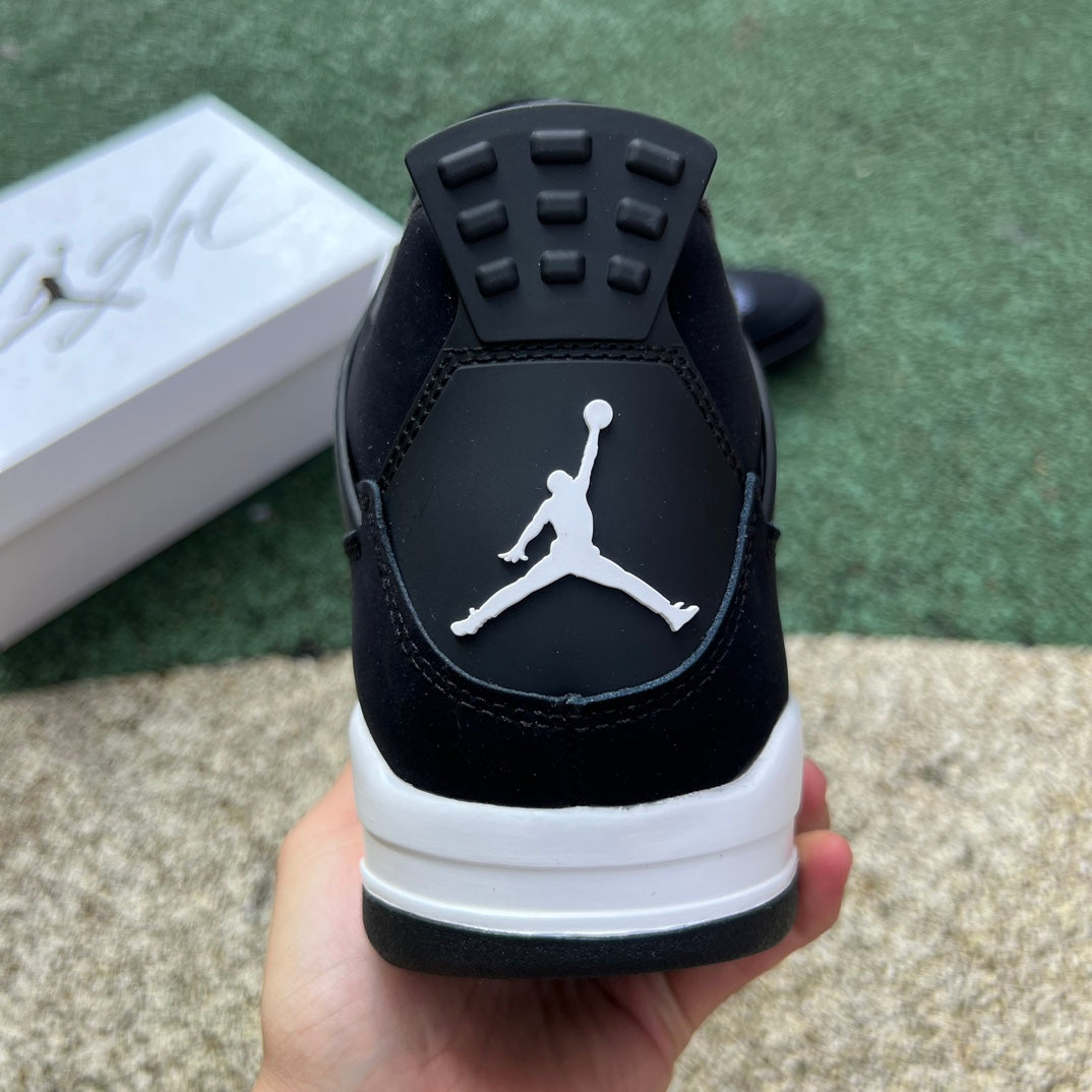 Nike Air Jordan 4 Retro White Thunder sneakers in white and yellow with black accents, featuring classic Jordan branding.