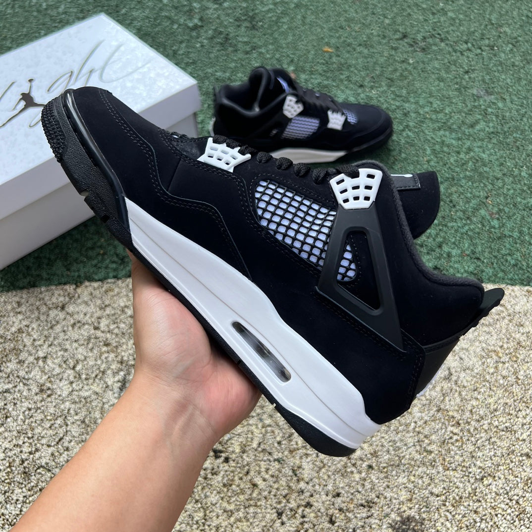 Nike Air Jordan 4 Retro White Thunder sneaker in white and yellow with black accents, showcasing the iconic design details.
