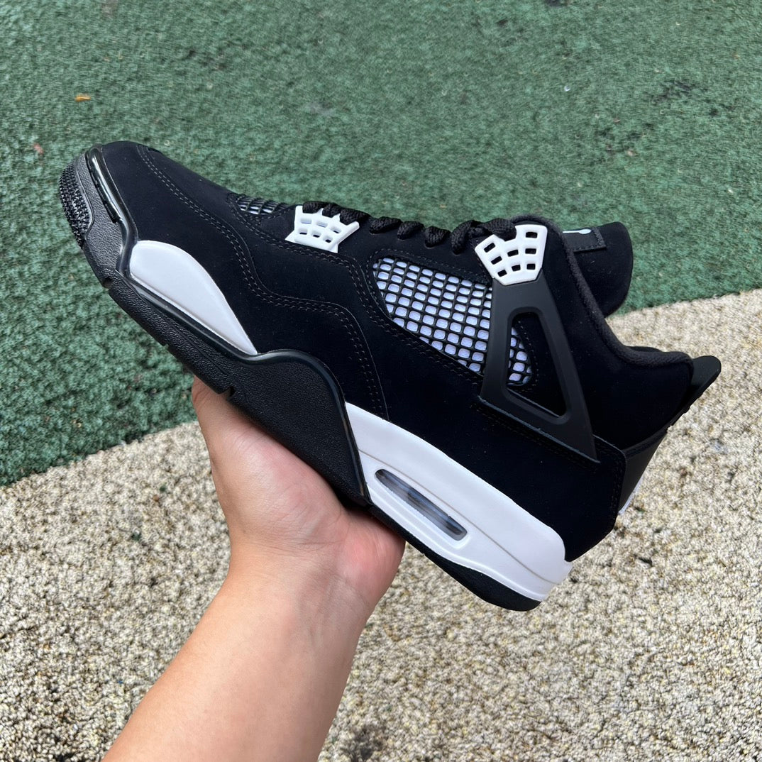 Nike Air Jordan 4 Retro White Thunder sneakers in white and yellow with black accents, showing side profile and design details.