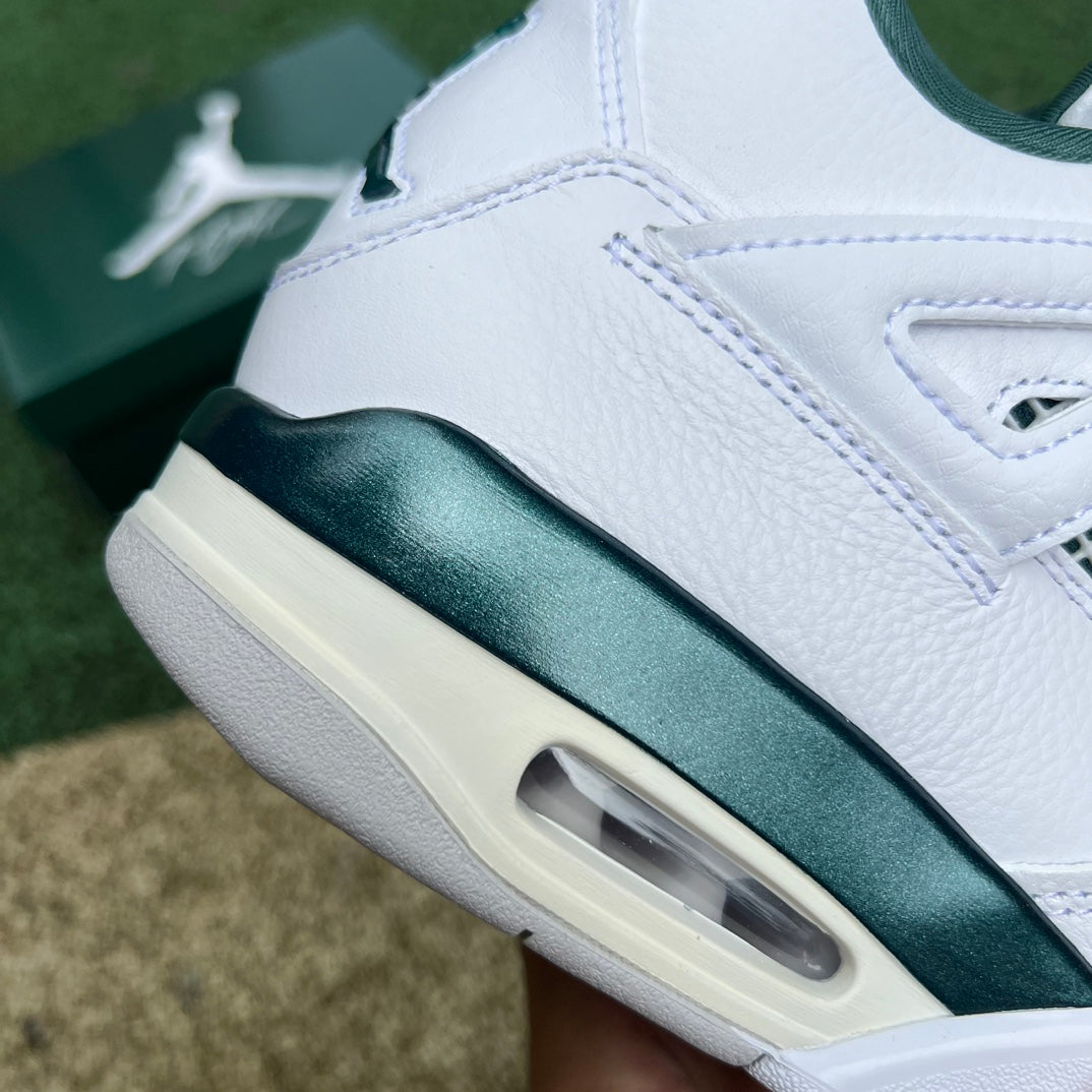 Nike Air Jordan 4 Retro Oxidized Green sneakers with white and green accents, featuring signature design details.