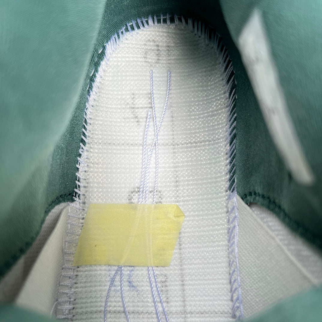 Nike Air Jordan 4 Retro Oxidized Green sneakers showing the side view and design details.