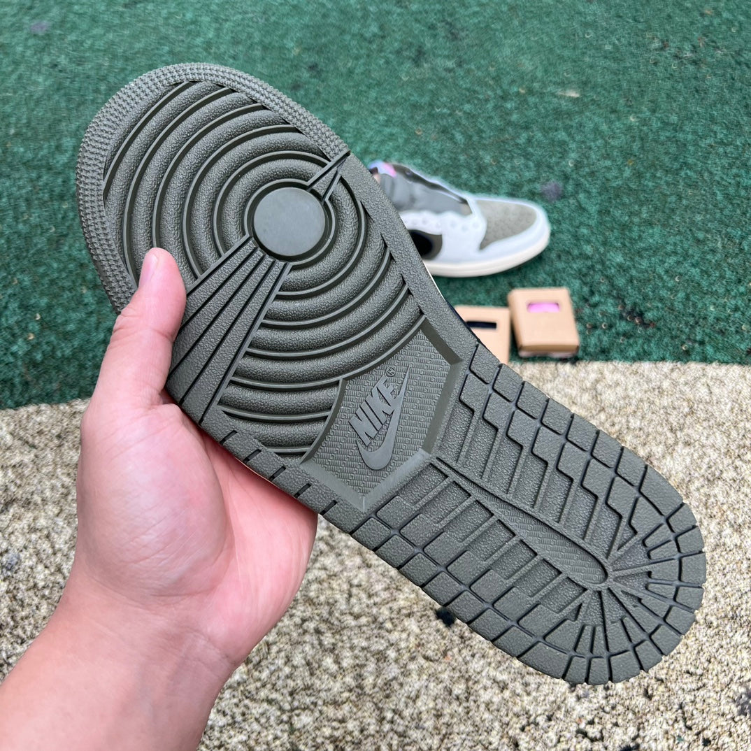 Nike Air Jordan 1 Retro Low OG SP Travis Scott sneakers in Medium Olive, featuring signature design and branding details.