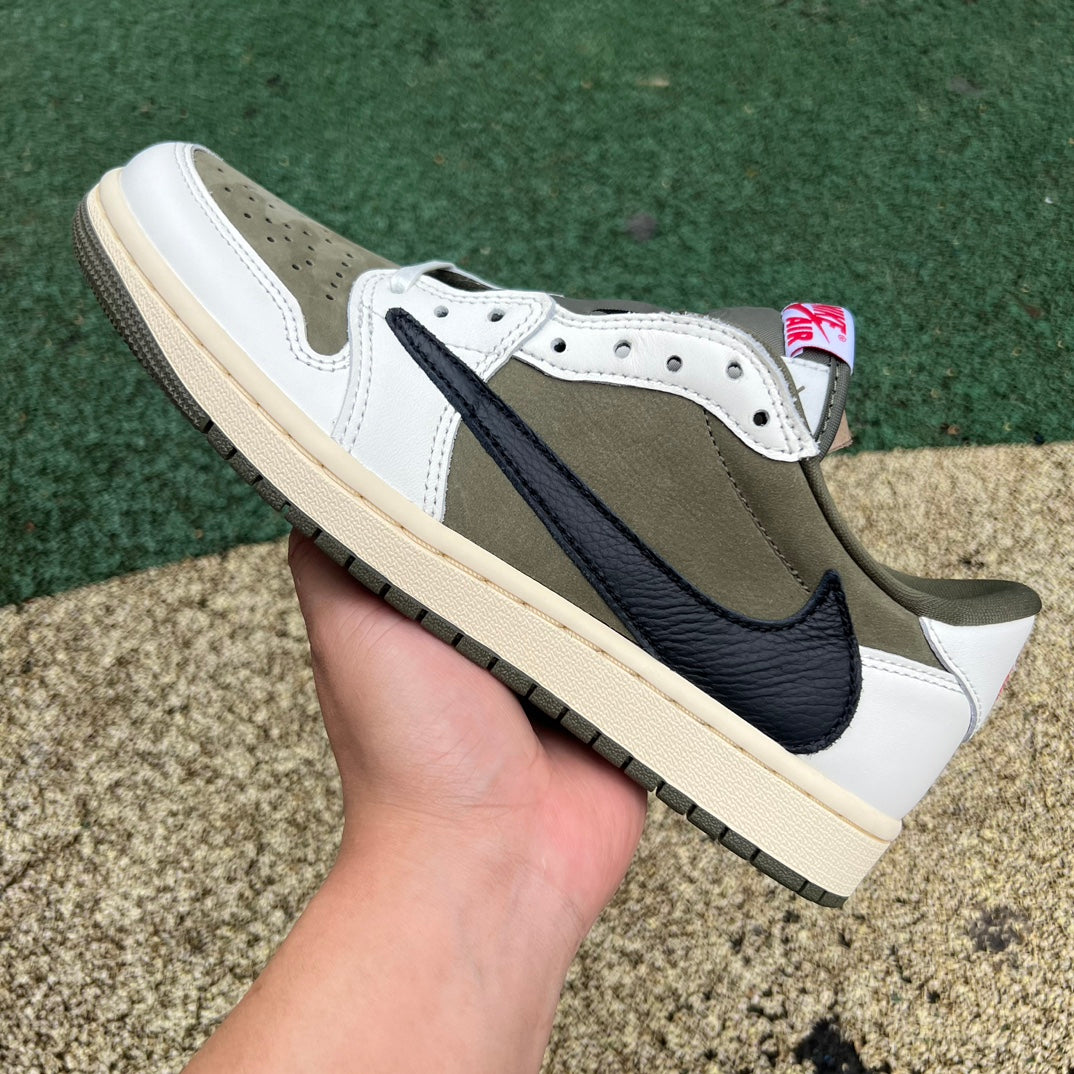 Nike Air Jordan 1 Retro Low OG SP Travis Scott sneakers in medium olive with black accents, showcasing the iconic design and branding.