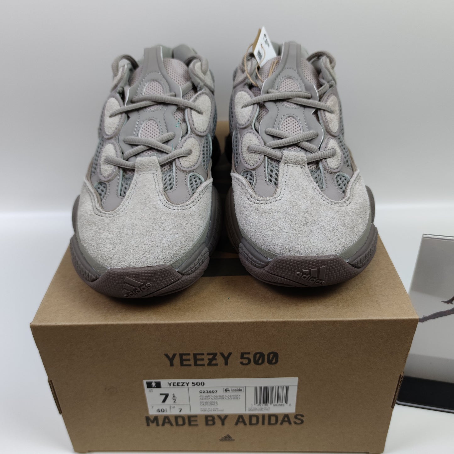Adidas Originals Yeezy 500 "Ash Grey" sneaker in grey with chunky design, featuring textured upper and thick sole.