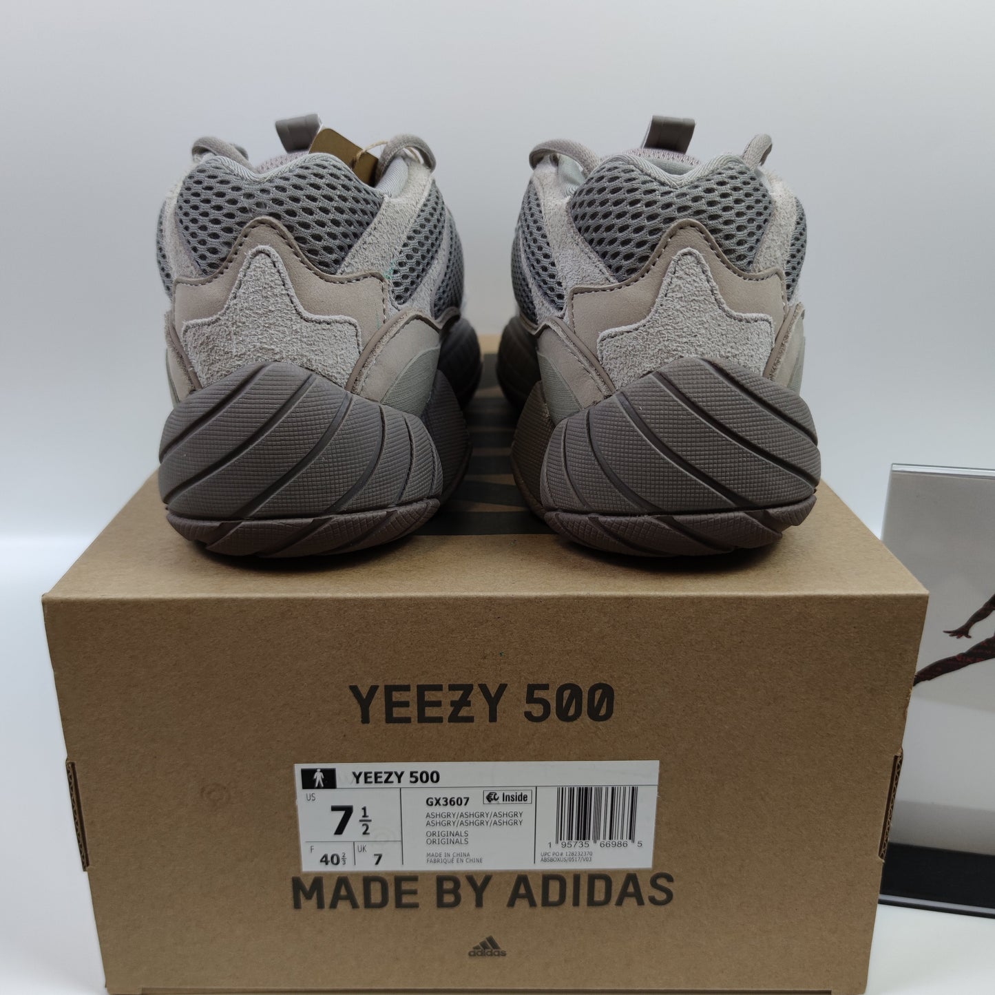 Adidas Originals Yeezy 500 Ash Grey sneaker with grey mesh and suede upper, chunky sole, and stylish design.