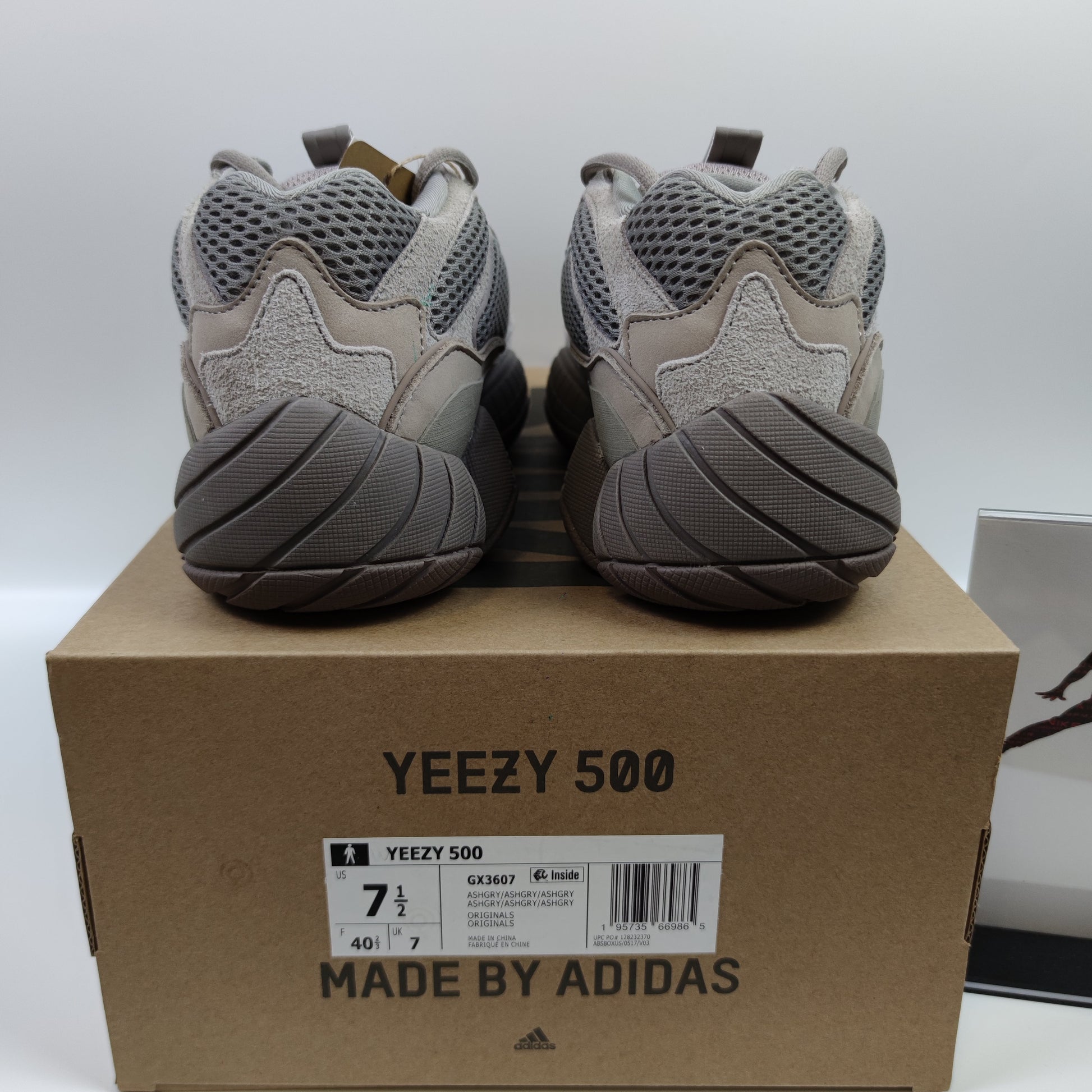 Adidas Originals Yeezy 500 Ash Grey sneaker with grey mesh and suede upper, chunky sole, and stylish design.