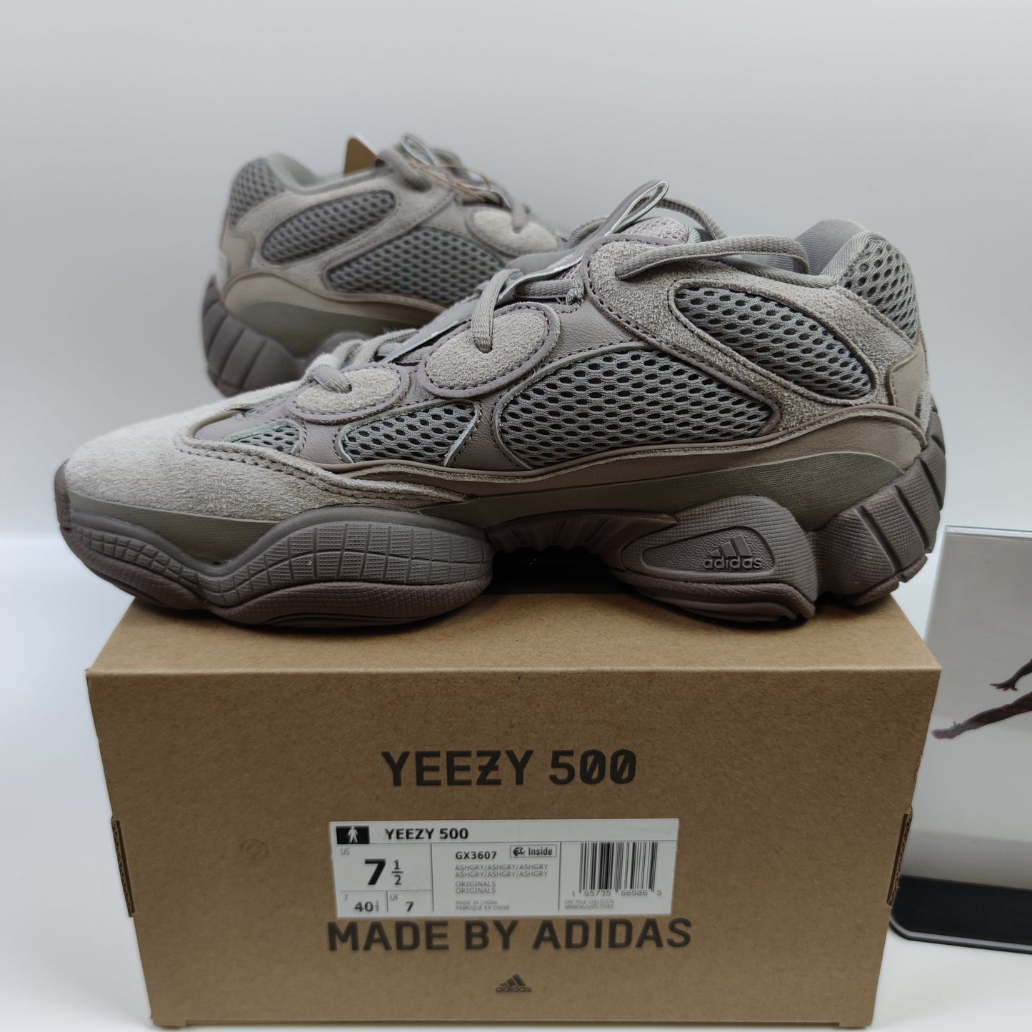 Adidas Originals Yeezy 500 Ash Grey sneaker with grey and beige suede and mesh upper, chunky design, and thick rubber sole.