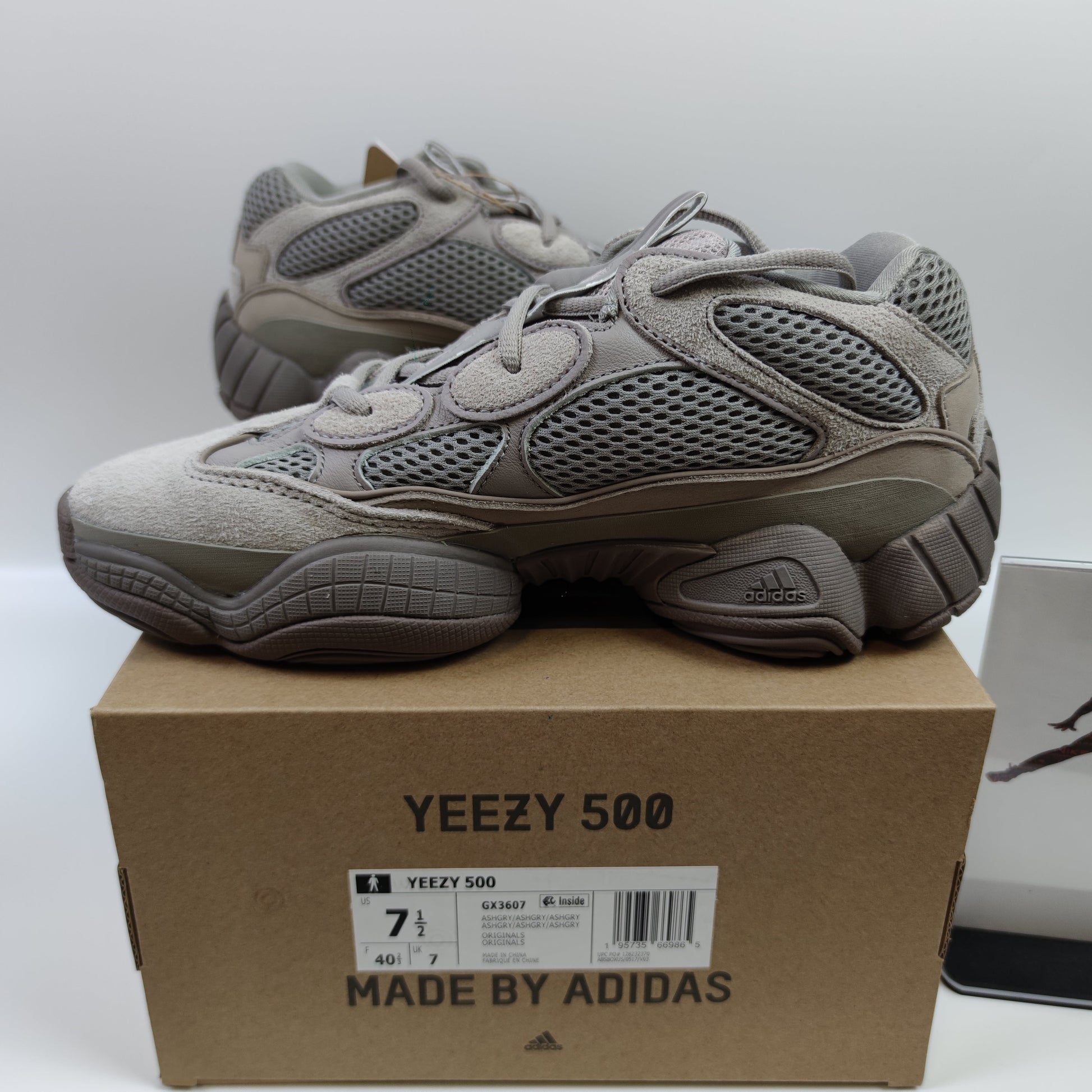 Adidas Originals Yeezy 500 Ash Grey sneaker with grey and beige suede and mesh upper, chunky design, and thick rubber sole.